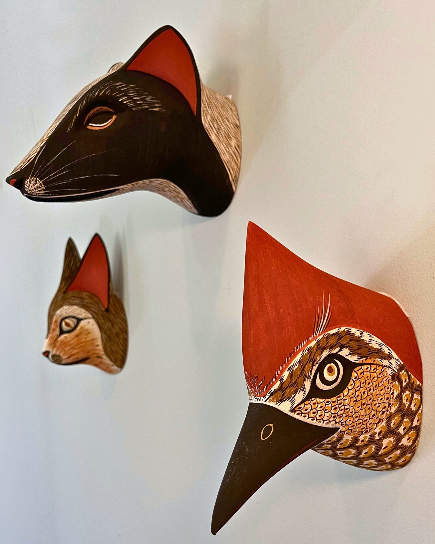 Handmade, hand carved wood, hand painted wooden animal head masks, artifact. One-of-a-kind, unique wall decor, sit-about home décor. Artisan made Chané masks in Argentina. Bird.