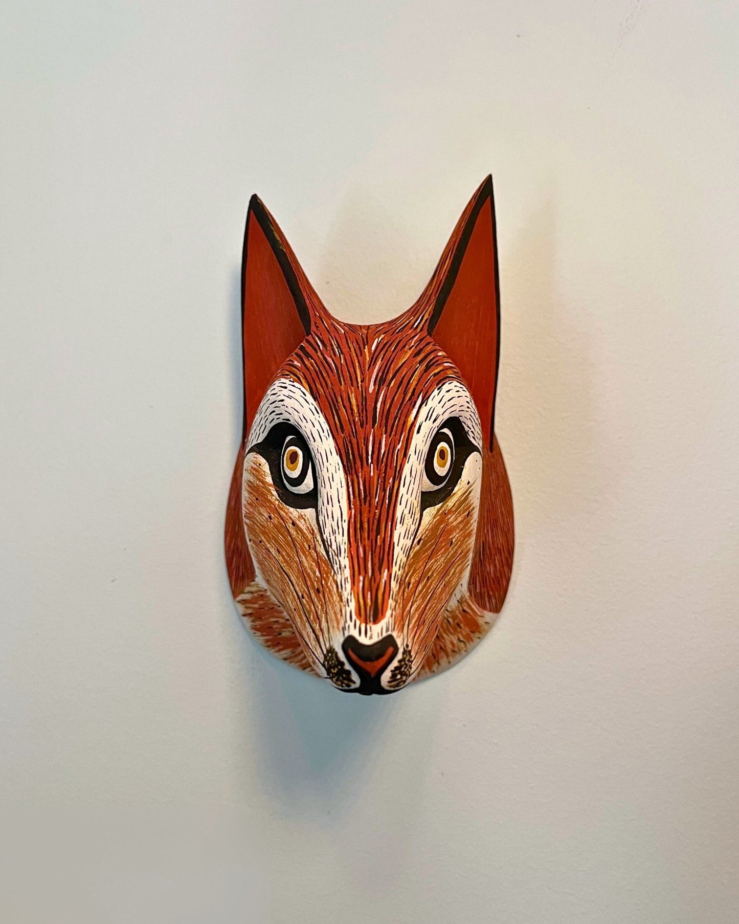 Handmade, hand carved wood, hand painted wooden animal head masks, artifact. One-of-a-kind, unique wall decor, sit-about home décor. Artisan made Chané masks in Argentina. Fox.