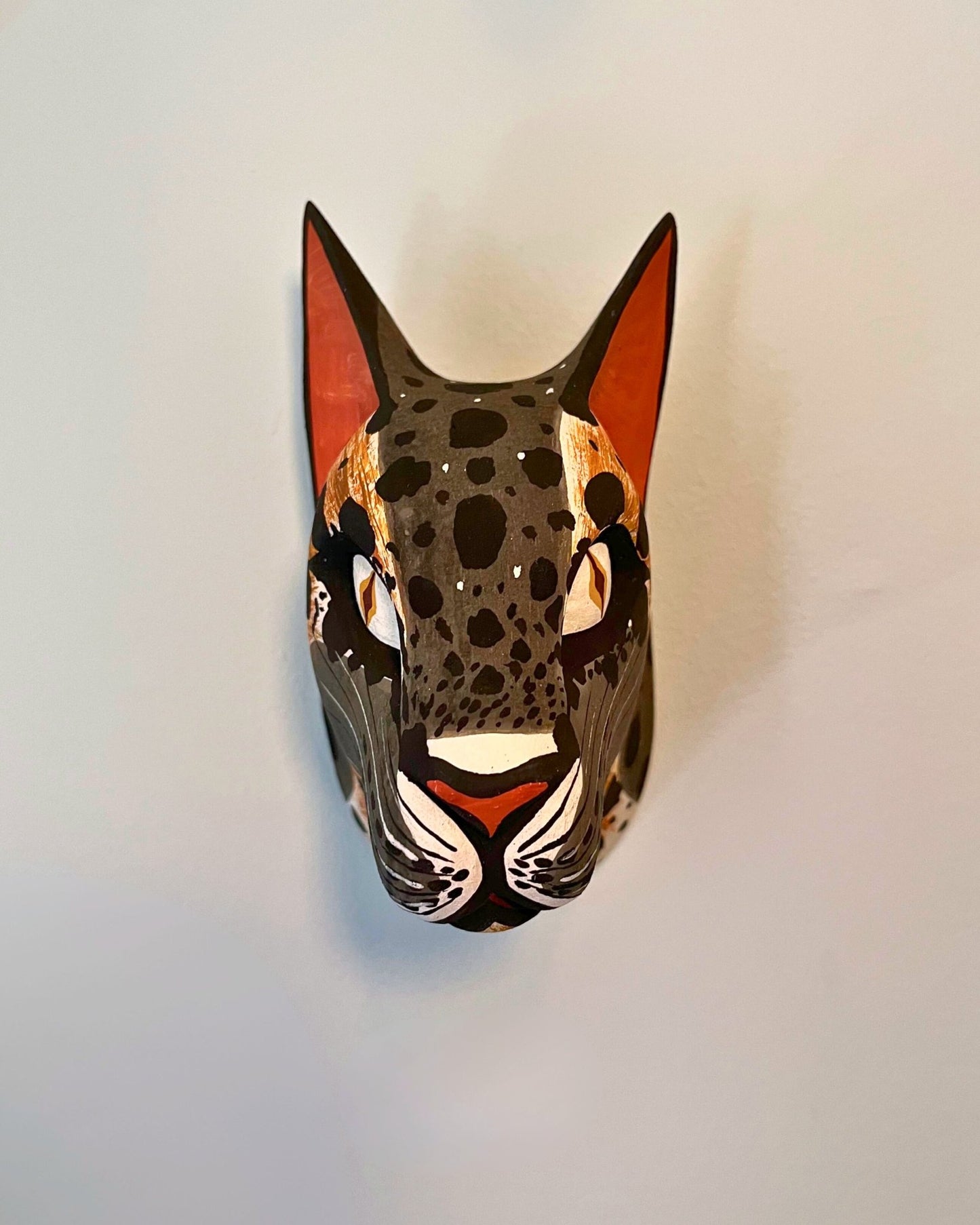 Handmade, hand carved wood, hand painted wooden animal heads. One-of-a-kind, unique tabletop decor, sit-about home décor. Artisan made from Chané artisans in Argentina. Jaguar.