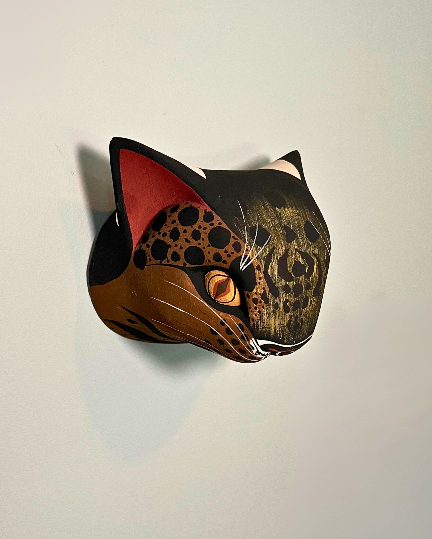 Handmade, hand carved wood, hand painted wooden animal head masks, artifact. One-of-a-kind, unique wall decor, sit-about home décor. Artisan made Chané masks in Argentina. Wild Cat.