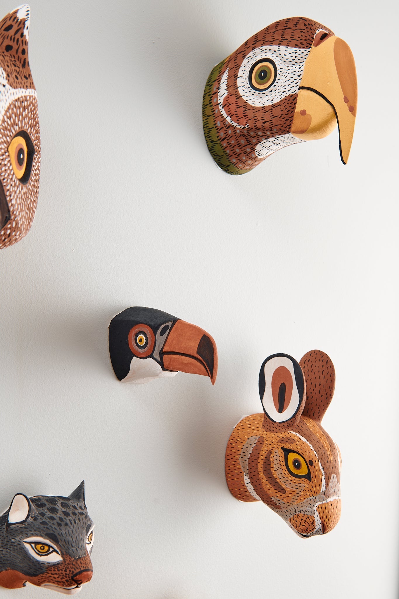 Handmade, hand carved wood, hand painted wooden animal head masks, artifact. One-of-a-kind, unique wall decor, sit-about home décor. Artisan made Chané masks in Argentina. Rabbit, Hare, Parrot, Toucan