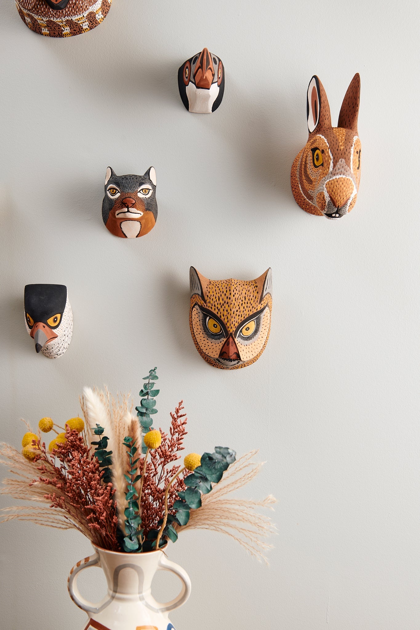 Handmade, hand carved wood, hand painted wooden animal head masks, artifact. One-of-a-kind, unique wall decor, sit-about home décor. Artisan made Chané masks in Argentina. Rabbit, Hare, Owl, Hawk
