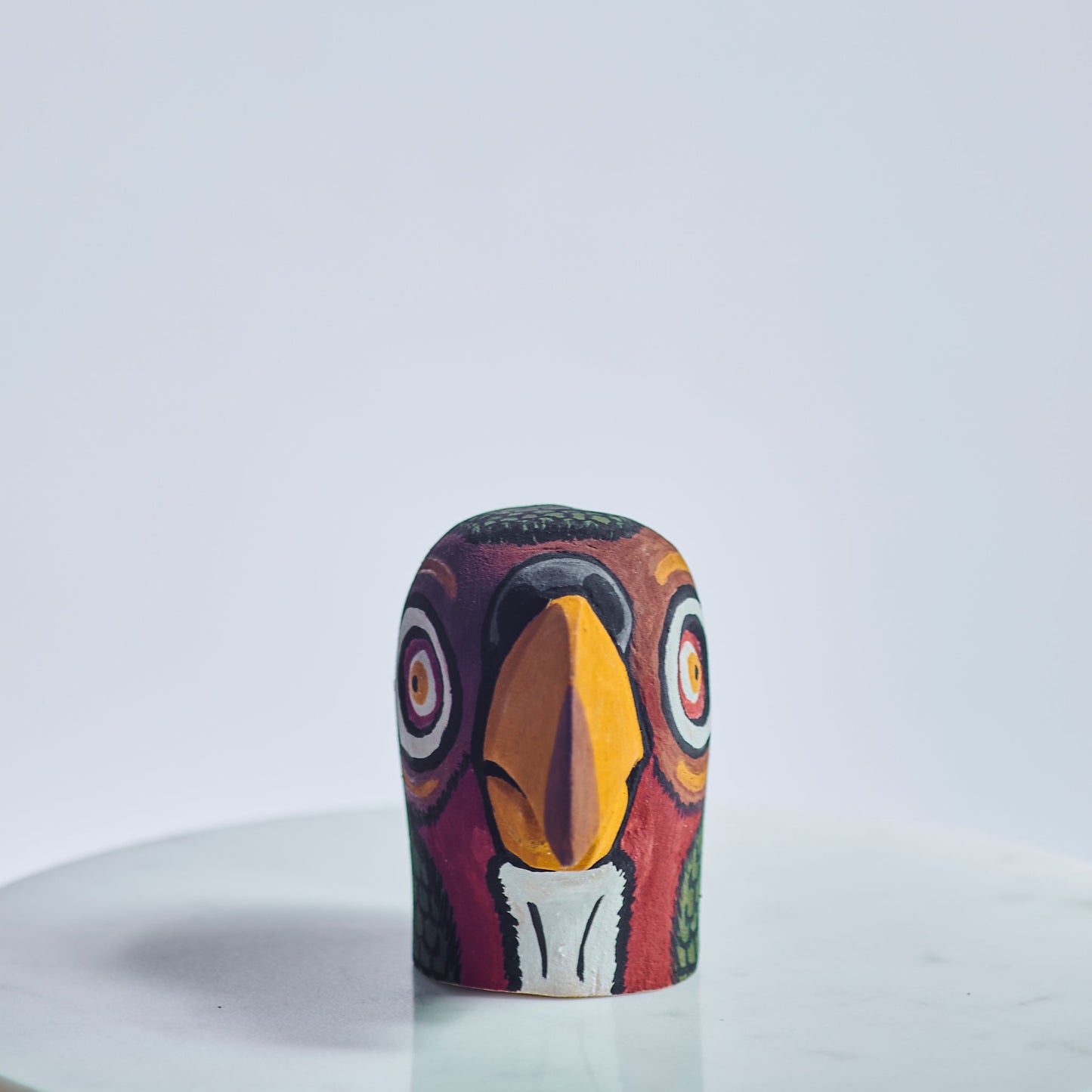 Handmade, hand carved wood, hand painted wooden animal heads. One-of-a-kind, unique tabletop decor, sit-about home décor. Artisan made from Chané artisans in Argentina. Parrot.