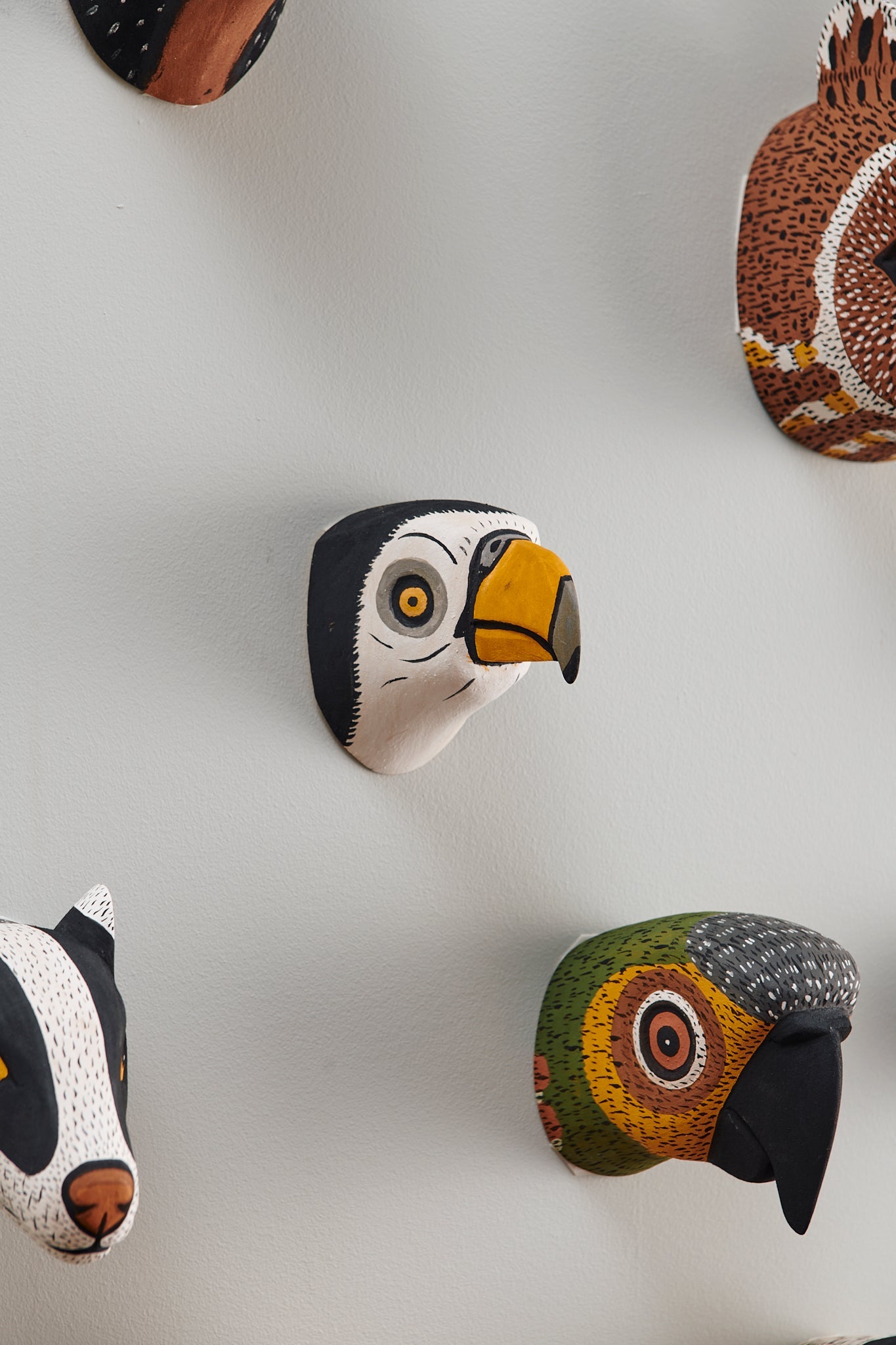 Handmade, hand carved wood, hand painted wooden animal head masks, artifact. One-of-a-kind, unique wall decor, sit-about home décor. Artisan made Chané masks in Argentina. Bird, Parrot