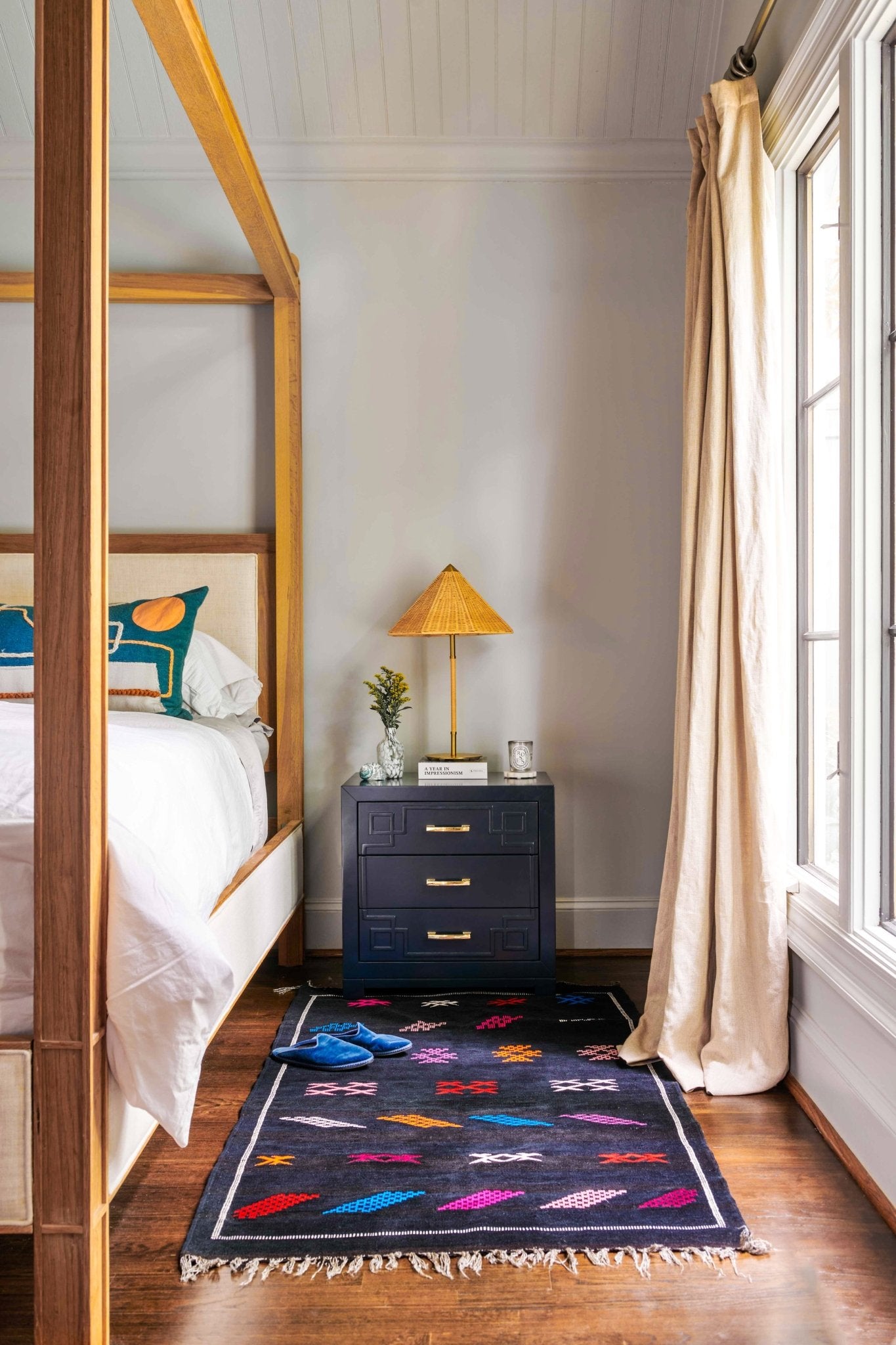 Moroccan Kilim rugs are handmade by women artisans in Morocco to be a very soft wool blend and a thin, flatweave style. Colorful, bright and vibrant colors for your living room, under dining table, or anywhere else for unique, ethnic home decor. Authentic Morocan, Morrocan style rug, black with bright geometric pattern.