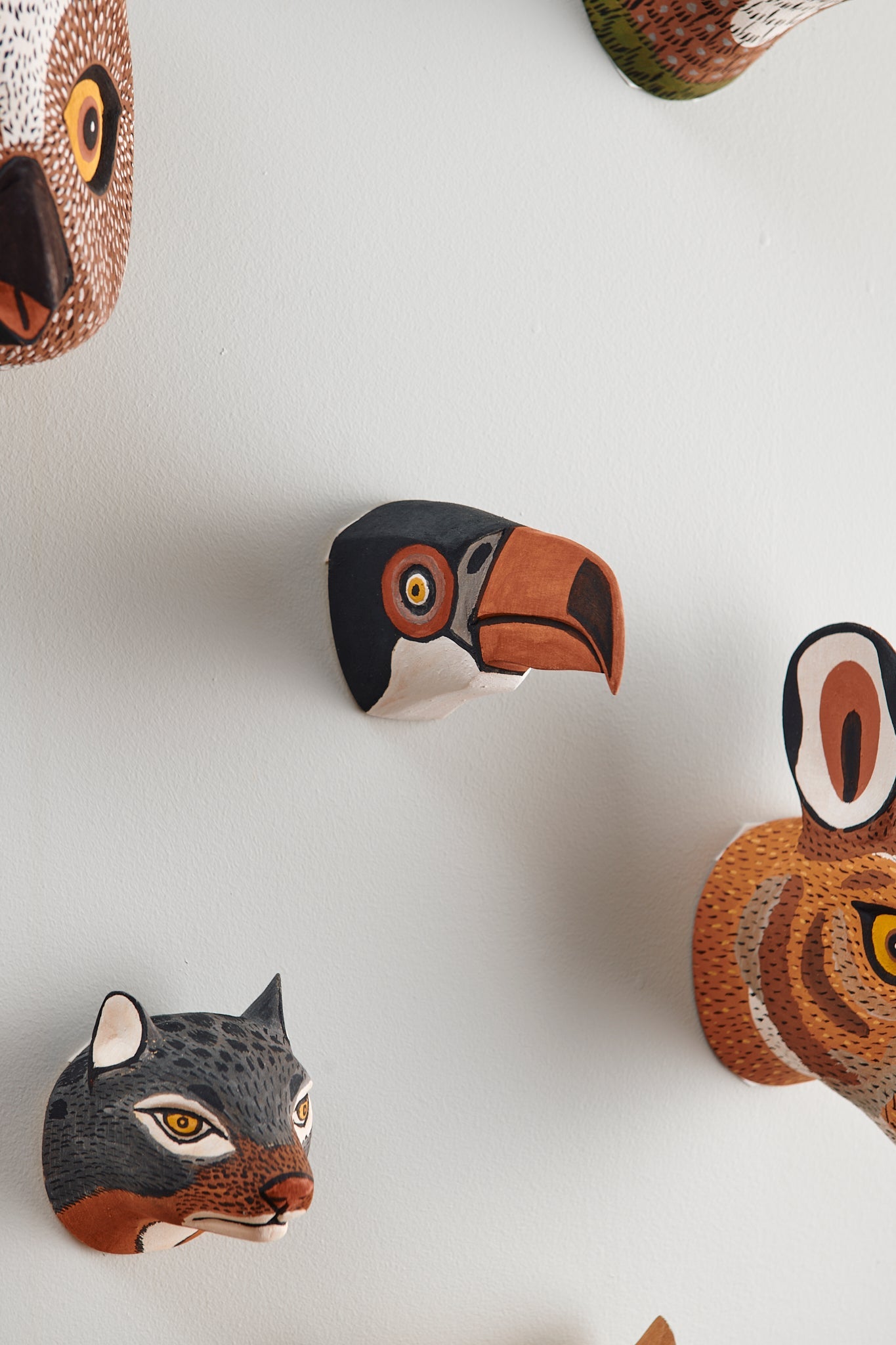 Handmade, hand carved wood, hand painted wooden animal head masks, artifact. One-of-a-kind, unique wall decor, sit-about home décor. Artisan made from Chané artisans in Argentina. Bird, Toucan, Wolf