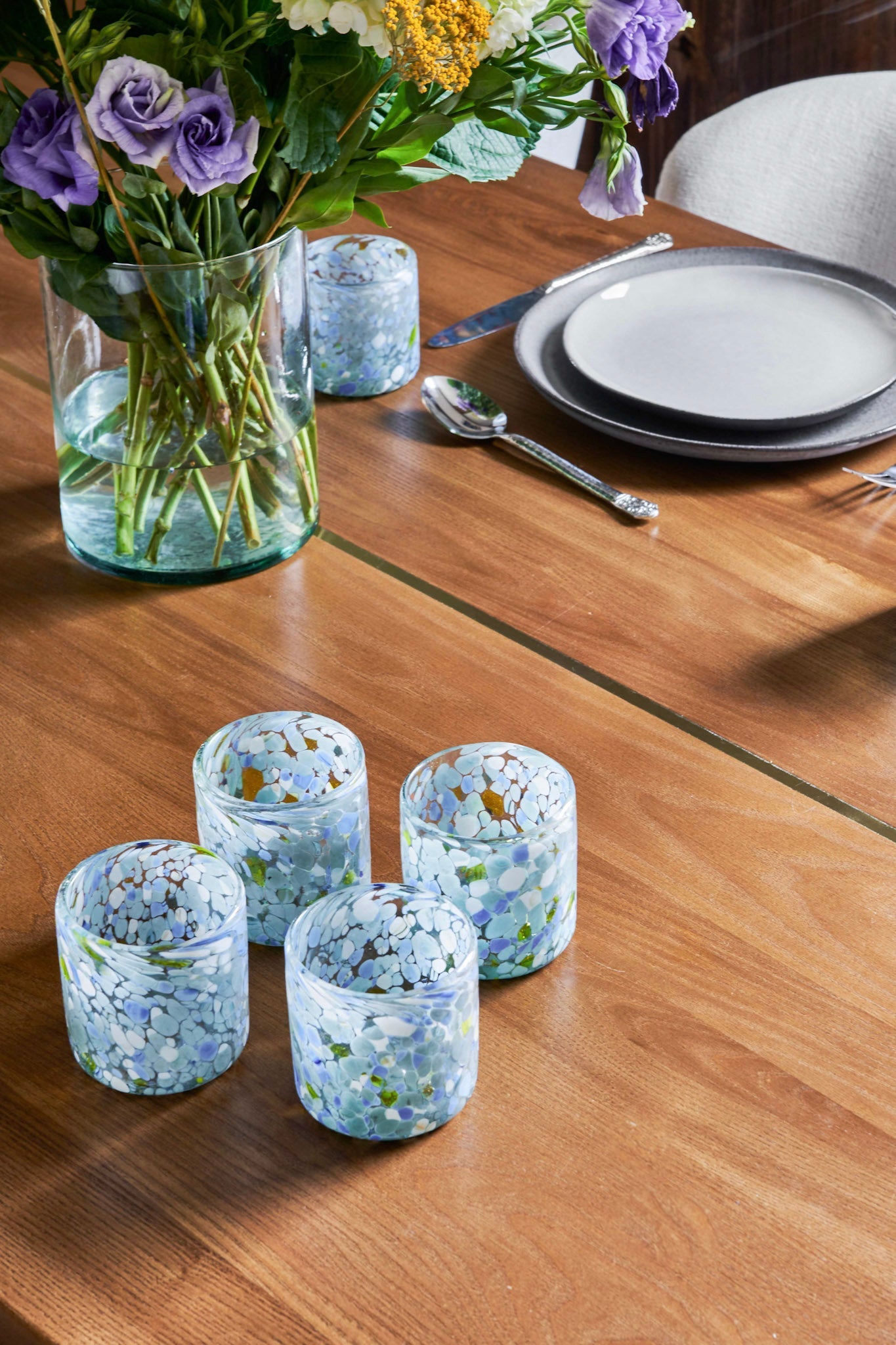 Blue Speckled Glass Tumblers are handmade from handblown glass in Guadalajara, Mexico. Use as glasses, drinkware for your table or a flower vase to show off the organic pattern. Tabletop decor.