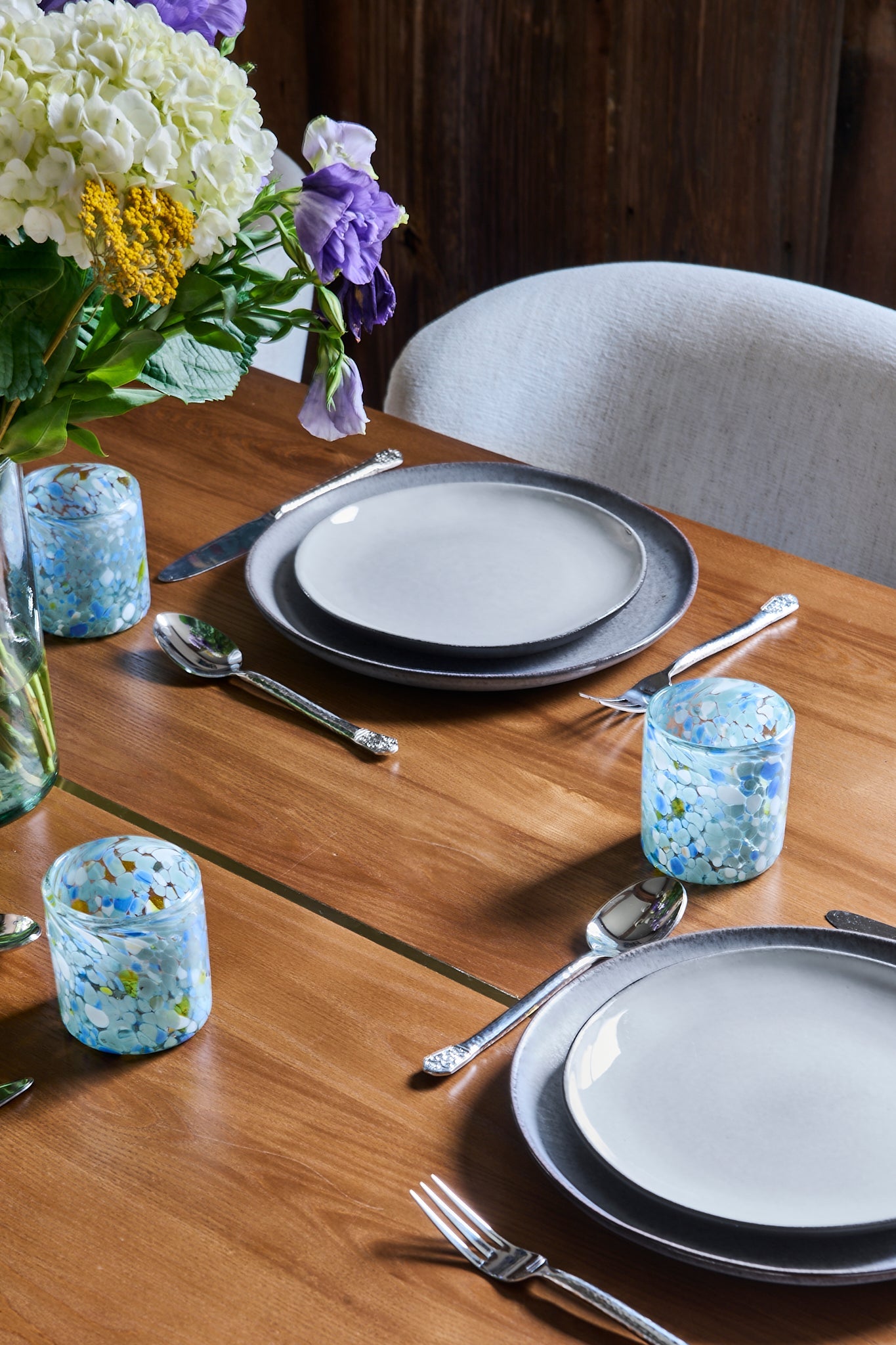 Blue Speckled Glass Tumblers are handmade from handblown glass in Guadalajara, Mexico. Use as glasses, drinkware for your table or a flower vase to show off the organic pattern. Tabletop decor, place setting.