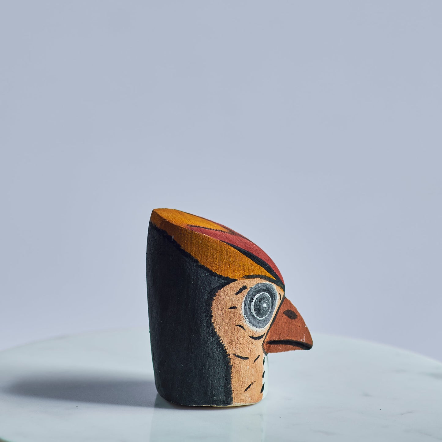 Handmade, hand carved wood, hand painted wooden animal heads. One-of-a-kind, unique tabletop decor, sit-about home décor. Artisan made from Chané artisans in Argentina. Woodpecker bird.