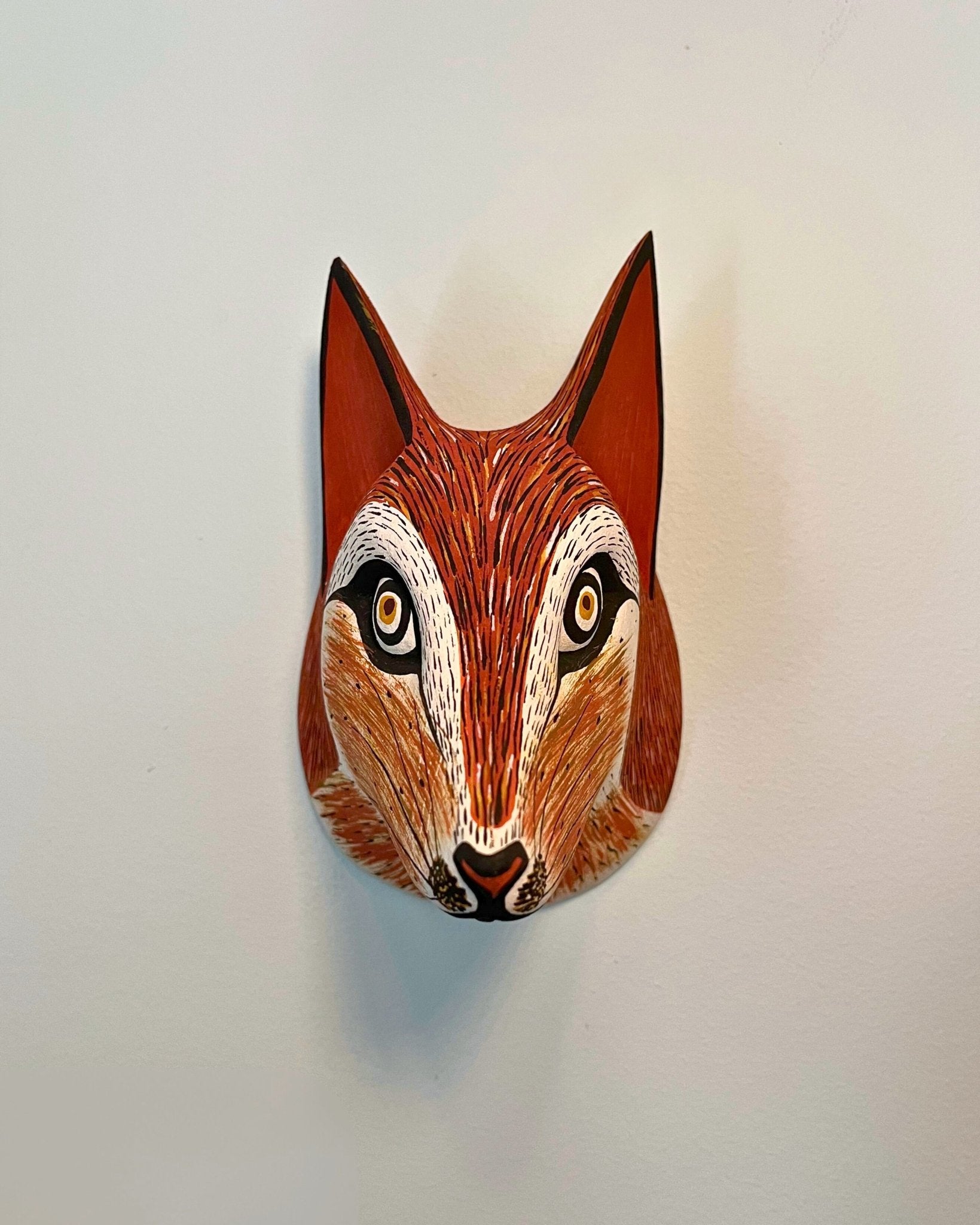 Handmade, hand carved wood, hand painted wooden animal head masks, artifact. One-of-a-kind, unique wall decor, sit-about home décor. Artisan made Chané masks in Argentina. Fox.