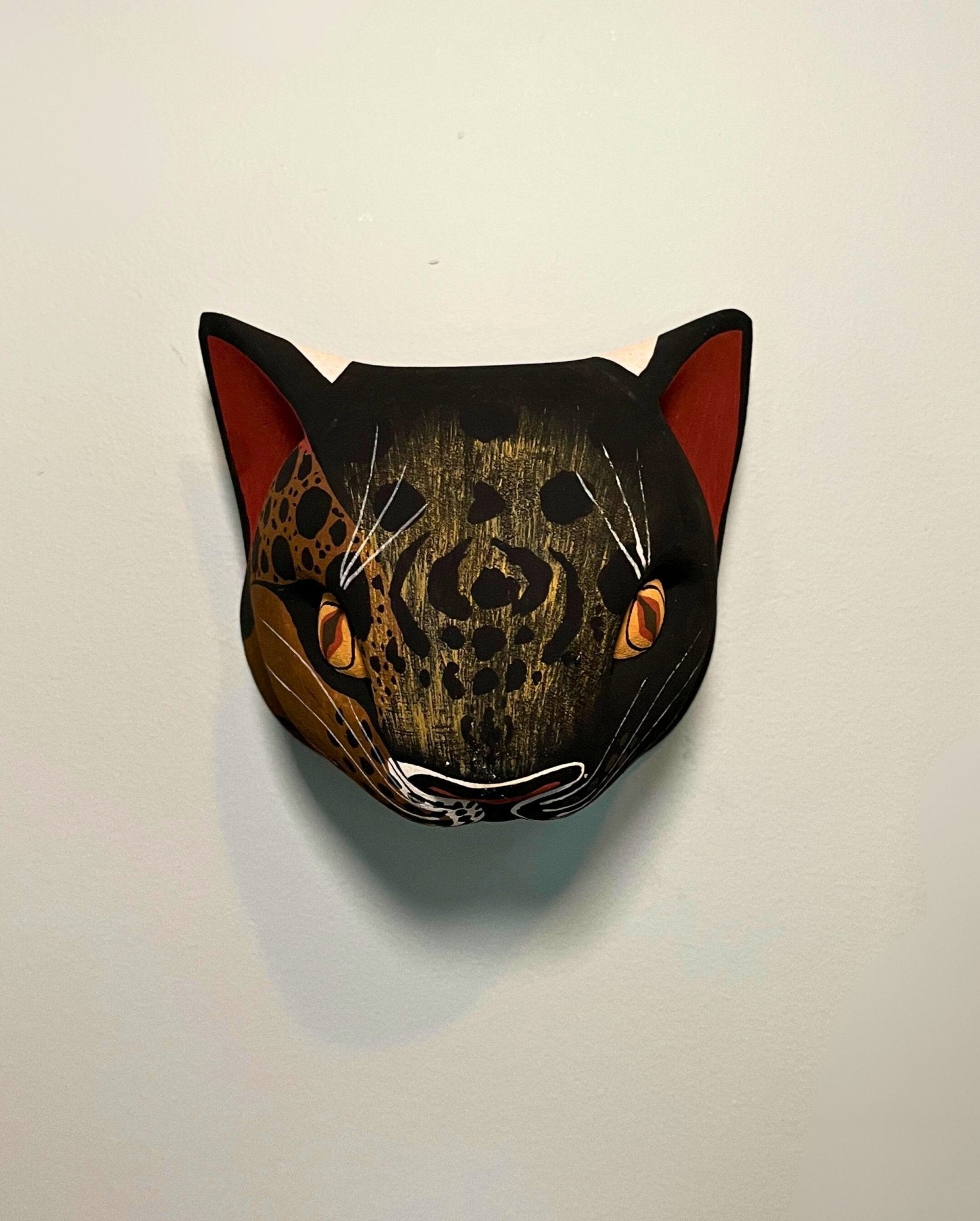 Handmade, hand carved wood, hand painted wooden animal head masks, artifact. One-of-a-kind, unique wall decor, sit-about home décor. Artisan made Chané masks in Argentina. Wild Cat.