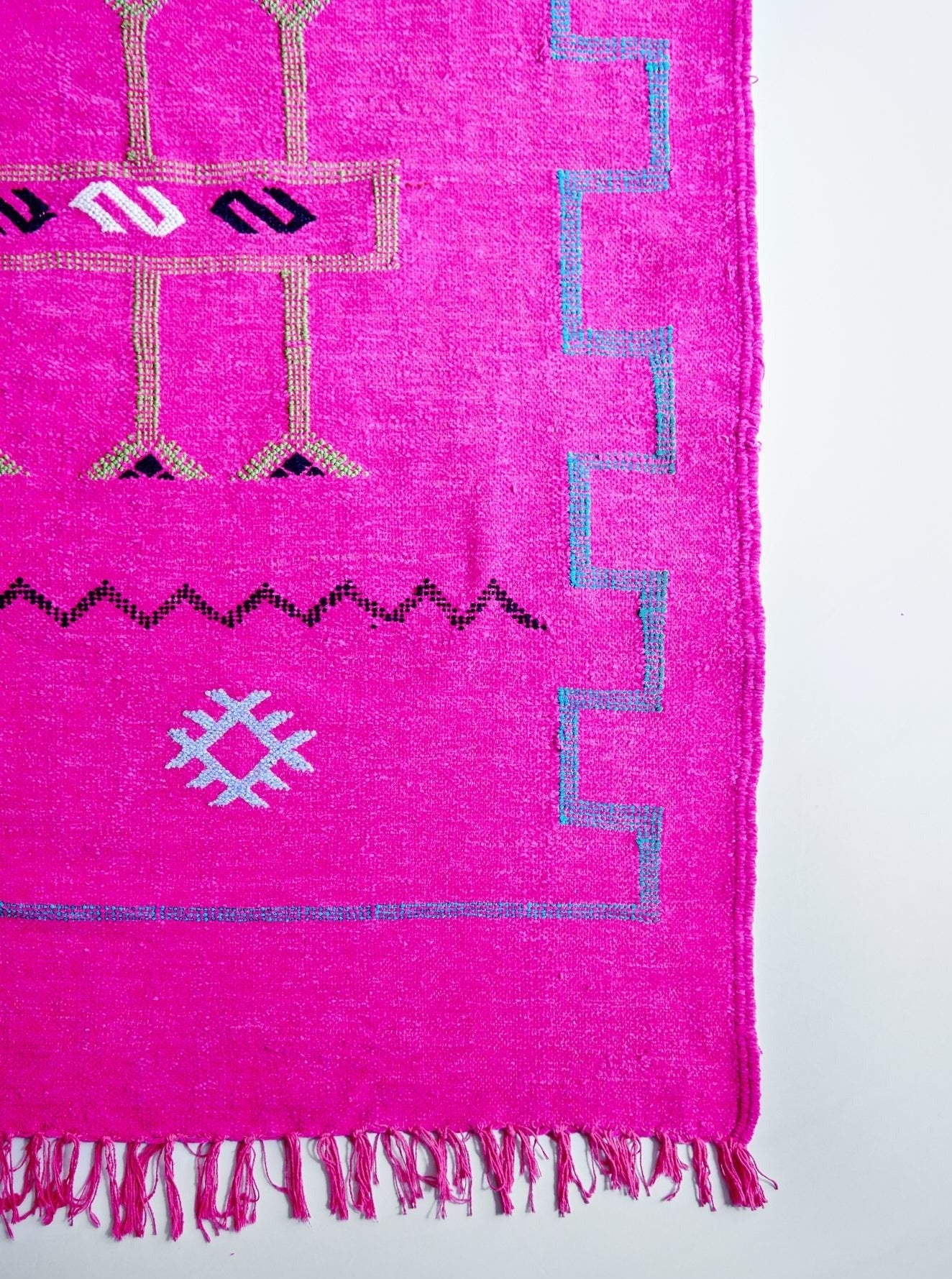 Moroccan Kilim rugs are handmade by women artisans in Morocco to be a very soft wool blend and a thin, flatweave style. Colorful, bright and vibrant colors for your living room, under dining table, or anywhere else for unique, ethnic home decor. Authentic Morocan, Morrocan style rug, bright, hot pink. Area floor rug