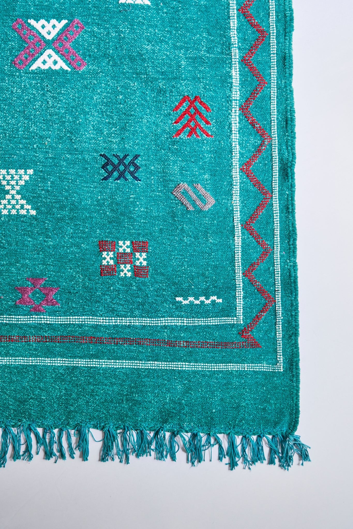 Moroccan Kilim rugs are handmade by women artisans in Morocco to be a very soft wool blend and a thin, flatweave style. Colorful, bright and vibrant colors for your living room, under dining table, or anywhere else for unique, ethnic home decor. Authentic Morocan, Morrocan style rug, bright teal. Area floor rug