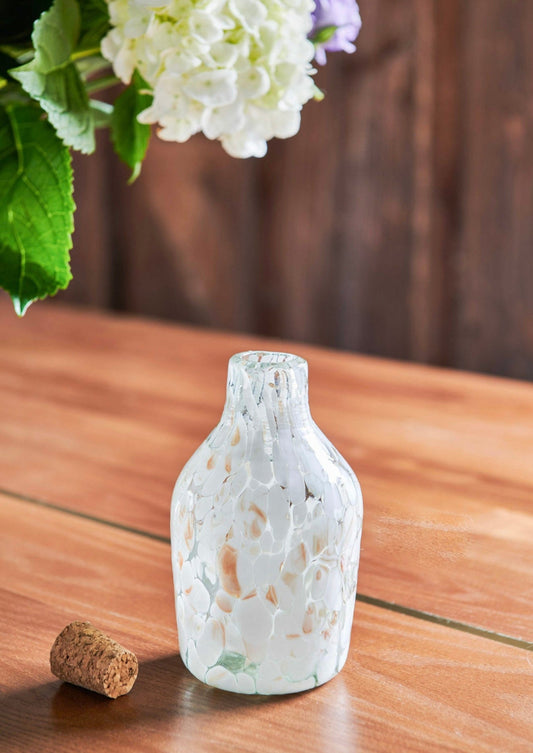 White Speckled Glass Longneck Bottle is handmade from handblown glass in Guadalajara, Mexico. Use as a flower vase or to store goods, liquor or syrups with included cork. Organic. Mexican Artisan made.