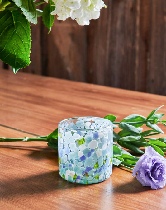 Blue Speckled Glass Tumblers are handmade from handblown glass in Guadalajara, Mexico. Use as glasses, drinkware for your table or a flower vase to show off the organic pattern.